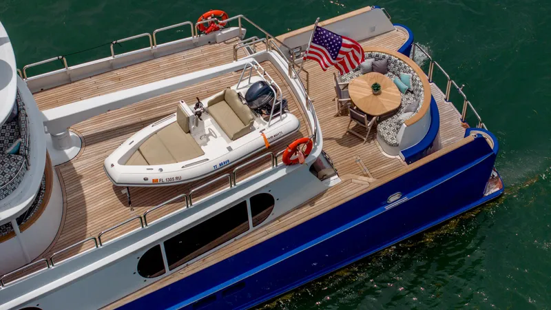 Bravo Yacht Photos Pics Aerial view of 1975 Stephens Brothers Expedition yacht deck with seating and American flag.