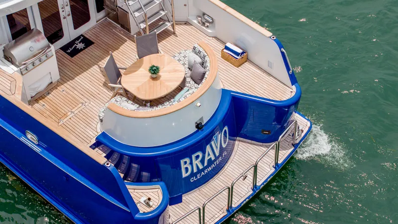 Bravo Yacht Photos Pics Luxurious 1975 Stephens Brothers Expedition yacht with elegant deck and seating area on the water.