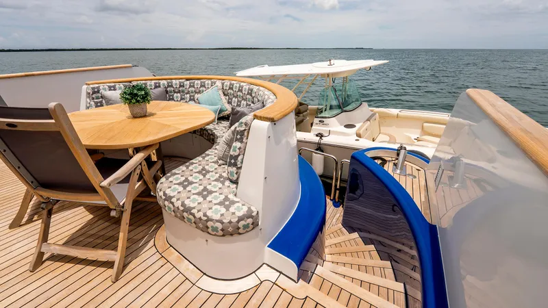 Bravo Yacht Photos Pics Luxurious 1975 Stephens Brothers Expedition yacht deck with seating and ocean view.