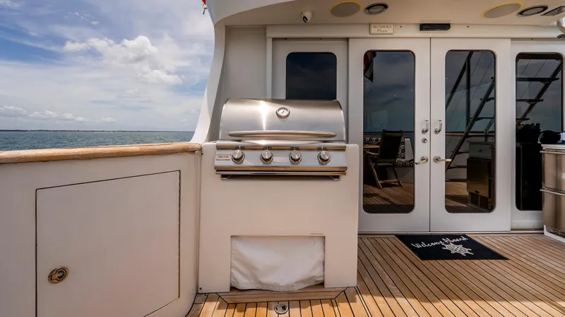 Bravo Yacht Photos Pics Outdoor grill on 1975 Stephens Brothers Expedition yacht deck, overlooking ocean.