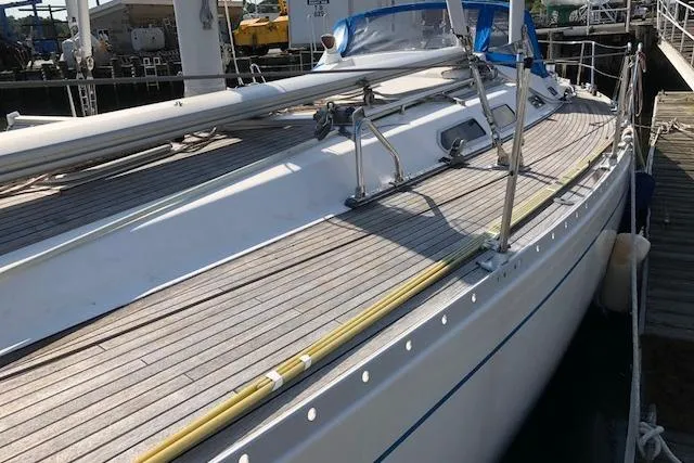 Dark N' Stormy III Yacht Photos Pics 1999 Sweden Yachts 45 sailboat docked, showcasing sleek deck design and nautical features.