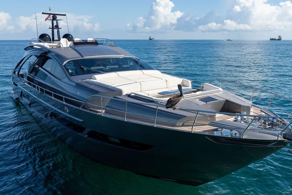 Luxurious 2019 Pershing 9X yacht cruising on calm blue waters.