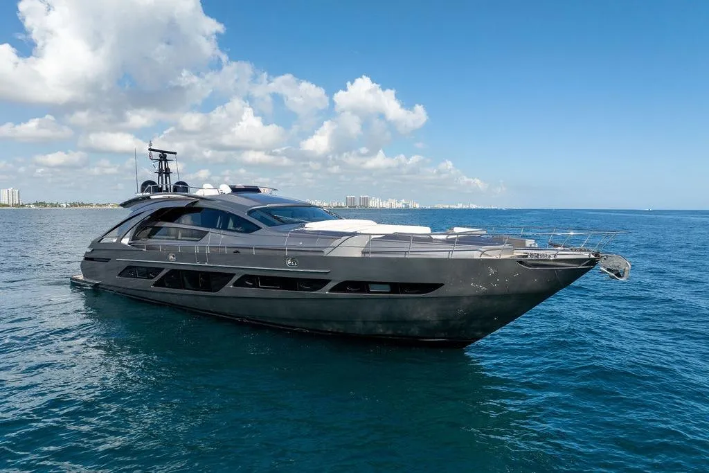 2019 Pershing 9X luxury yacht cruising on open sea under clear blue sky.