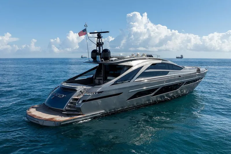 One Spin 3 Yacht Photos Pics 2019 Pershing 9X luxury yacht cruising on open sea under clear skies.