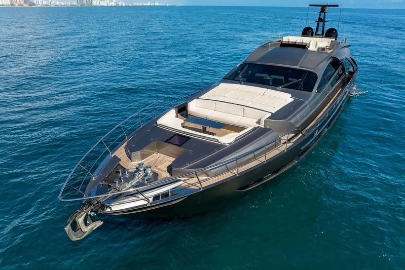 One Spin 3 Yacht Photos Pics Luxurious 2019 Pershing 9X yacht cruising on clear blue ocean waters.