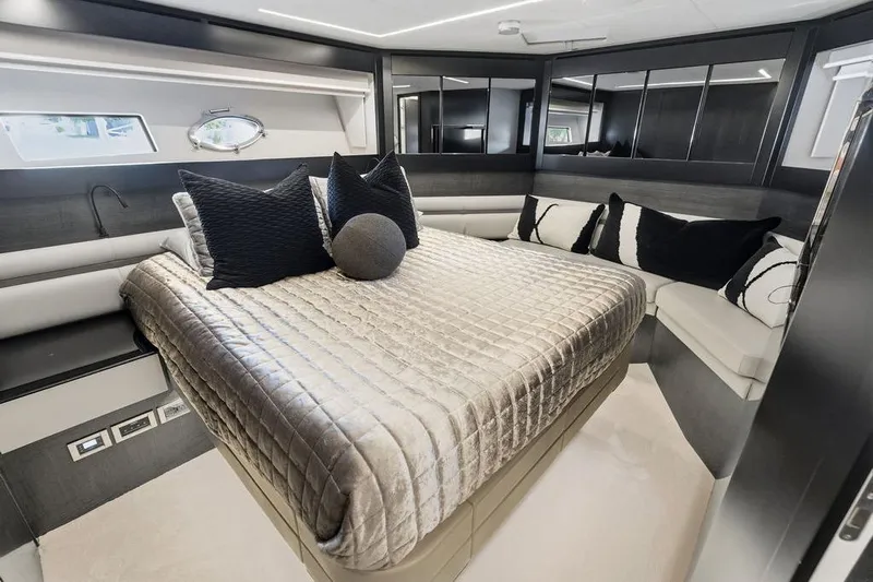 One Spin 3 Yacht Photos Pics Luxurious interior of 2019 Pershing 9X yacht with elegant bedding and modern design.