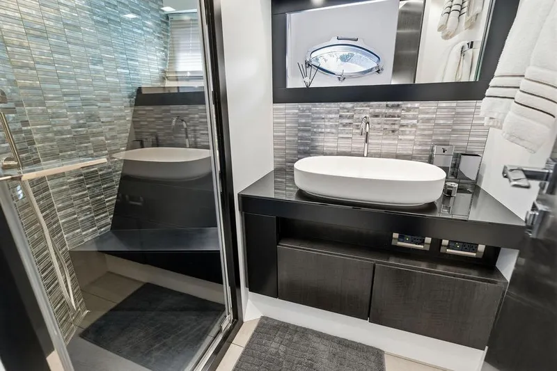 One Spin 3 Yacht Photos Pics Luxurious bathroom in 2019 Pershing 9X yacht with modern fixtures and sleek design.
