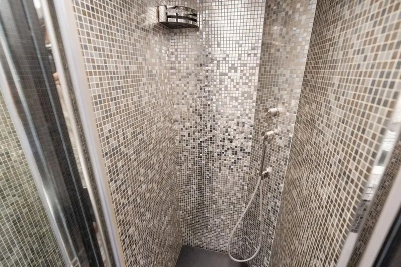 One Spin 3 Yacht Photos Pics Luxurious mosaic-tiled shower in 2019 Pershing 9X yacht bathroom.