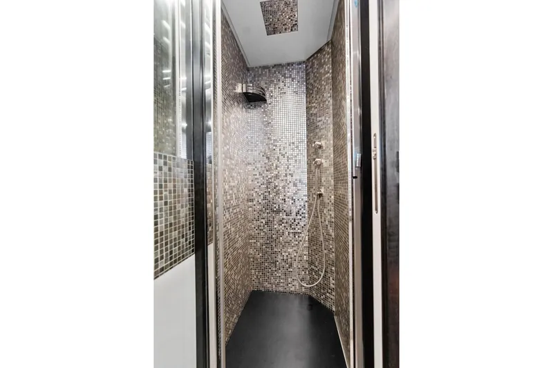 One Spin 3 Yacht Photos Pics Luxurious mosaic-tiled shower in 2019 Pershing 9X yacht bathroom.