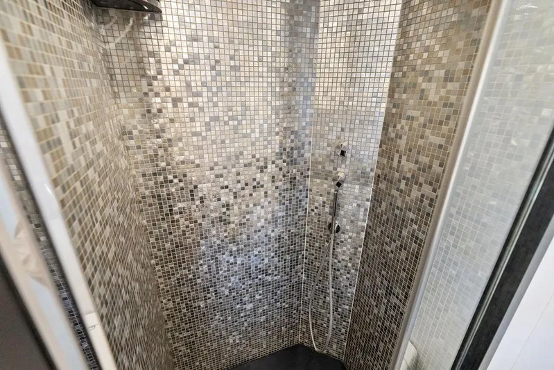 One Spin 3 Yacht Photos Pics Luxurious mosaic-tiled shower in 2019 Pershing 9X yacht bathroom.