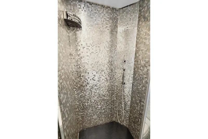 One Spin 3 Yacht Photos Pics Luxurious mosaic-tiled shower in 2019 Pershing 9X yacht bathroom.