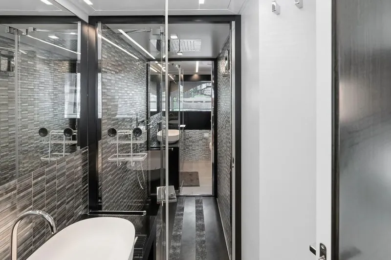 One Spin 3 Yacht Photos Pics Luxurious bathroom interior of 2019 Pershing 9X yacht with modern design elements.