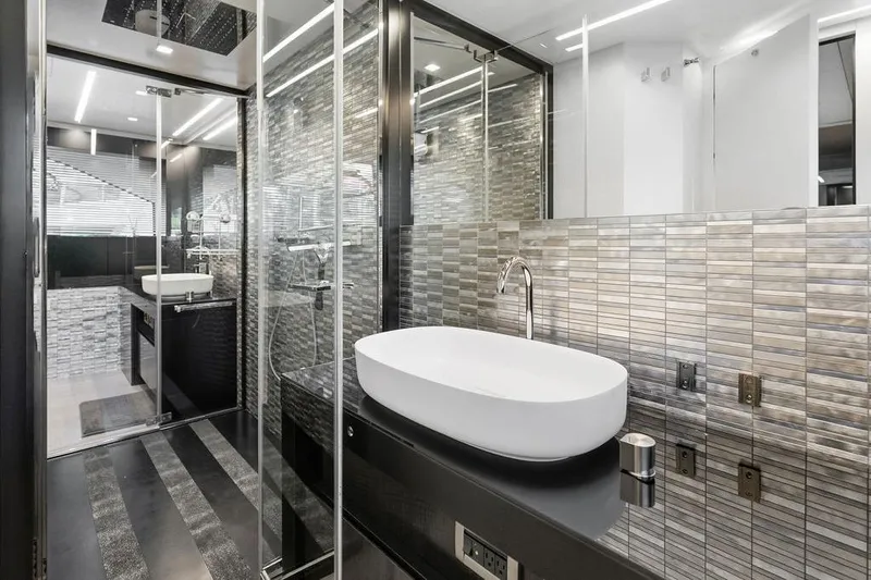 One Spin 3 Yacht Photos Pics Luxurious bathroom interior on a 2019 Pershing 9X yacht, featuring modern design and sleek fixtures.