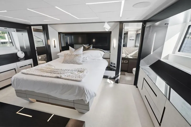 One Spin 3 Yacht Photos Pics Luxurious bedroom interior of 2019 Pershing 9X yacht, featuring modern design and elegant furnishings.