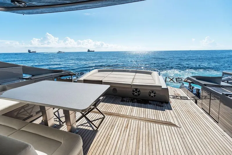 One Spin 3 Yacht Photos Pics Luxurious 2019 Pershing 9X yacht deck with ocean view and elegant seating area.