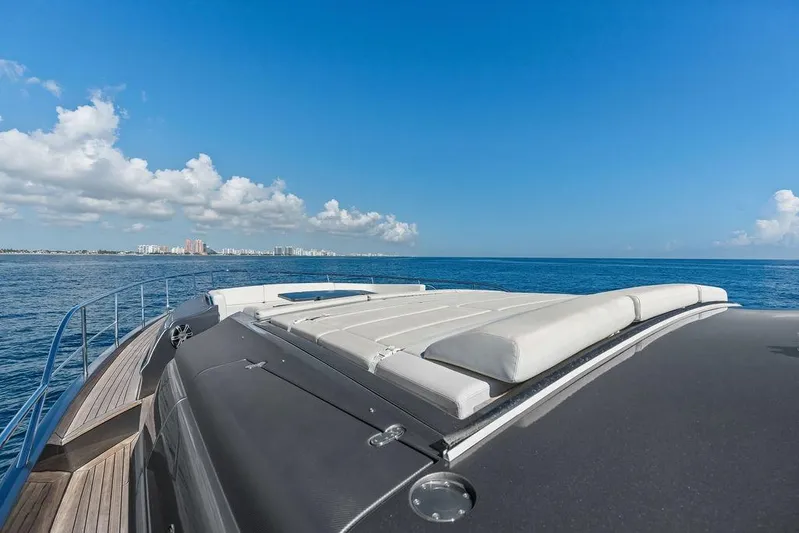 One Spin 3 Yacht Photos Pics 2019 Pershing 9X yacht deck with ocean view and clear blue sky.