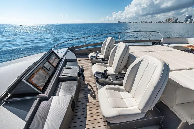 One Spin 3 Yacht Photos Pics Luxurious 2019 Pershing 9X yacht deck with plush seating and ocean view.