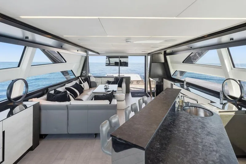 One Spin 3 Yacht Photos Pics Luxurious interior of 2019 Pershing 9X yacht with modern design and ocean view.