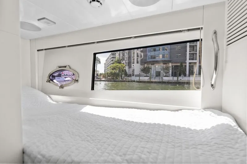 One Spin 3 Yacht Photos Pics Luxurious interior cabin of 2019 Pershing 9X yacht with waterfront view.