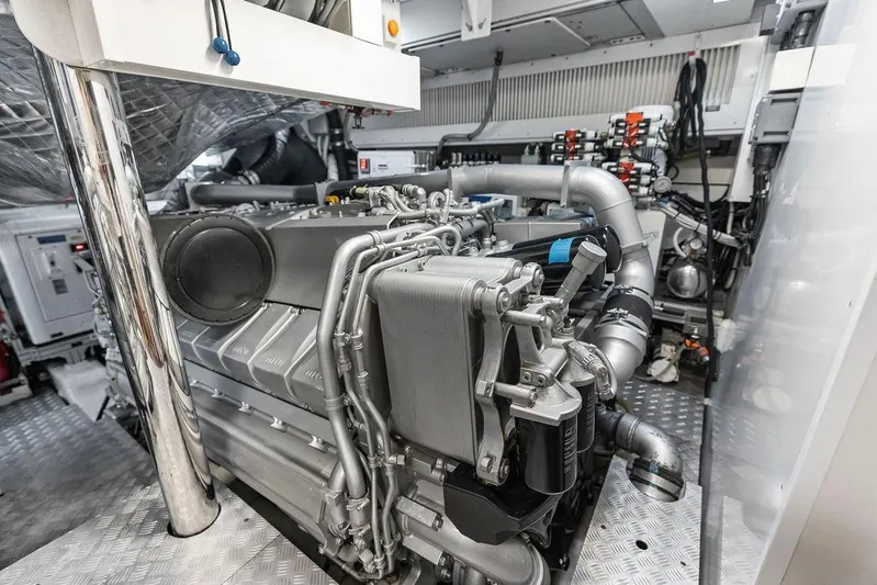 One Spin 3 Yacht Photos Pics Engine room of a 2019 Pershing 9X yacht, showcasing advanced machinery and components.