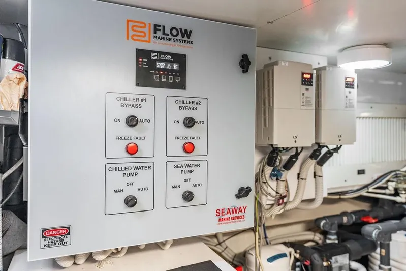 One Spin 3 Yacht Photos Pics Control panel of a 2019 Pershing 9X yacht's marine systems, featuring chiller and pump controls.