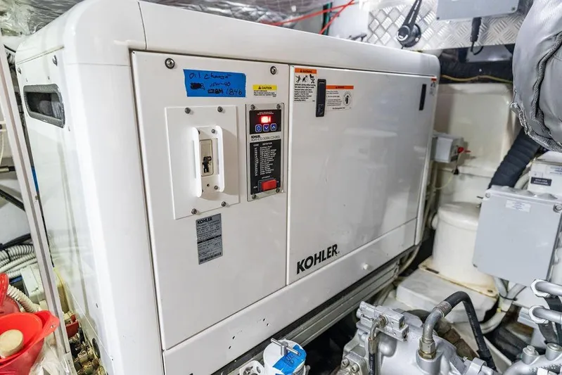 One Spin 3 Yacht Photos Pics Engine room of 2019 Pershing 9X yacht featuring a Kohler generator.