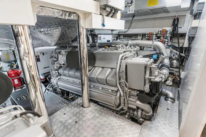 One Spin 3 Yacht Photos Pics Engine room of a 2019 Pershing 9X yacht, showcasing advanced machinery and equipment.