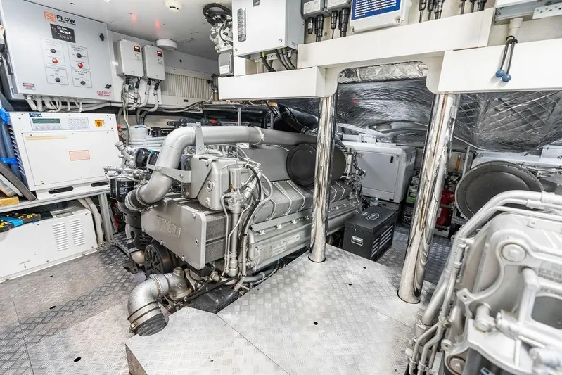 One Spin 3 Yacht Photos Pics Engine room of a 2019 Pershing 9X yacht, showcasing advanced machinery and equipment.