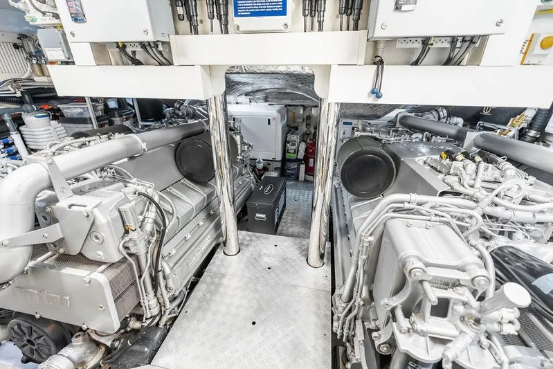 One Spin 3 Yacht Photos Pics Engine room of a 2019 Pershing 9X yacht, showcasing advanced machinery and equipment.