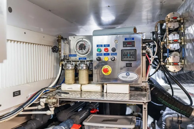 One Spin 3 Yacht Photos Pics Engine room of 2019 Pershing 9X yacht with control panel and gauges.