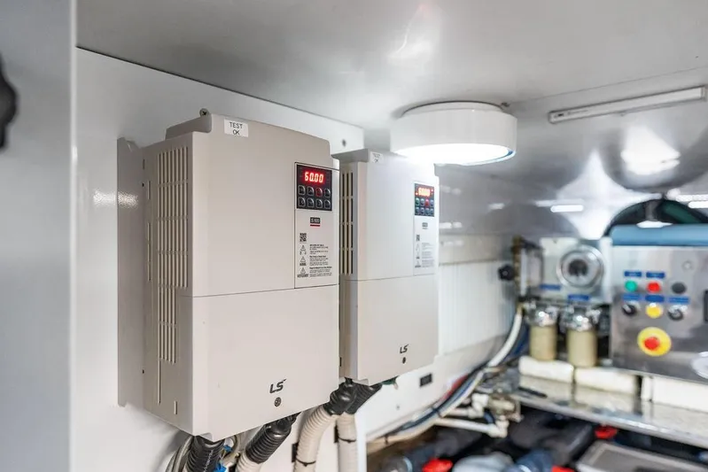 One Spin 3 Yacht Photos Pics Engine room of 2019 Pershing 9X yacht with control panels and equipment.