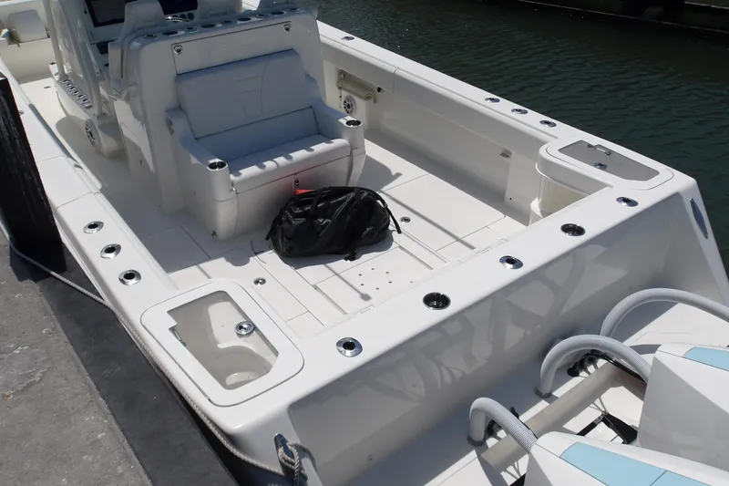  Yacht Photos Pics 2022 SeaVee 370z boat deck with seating and storage compartments.