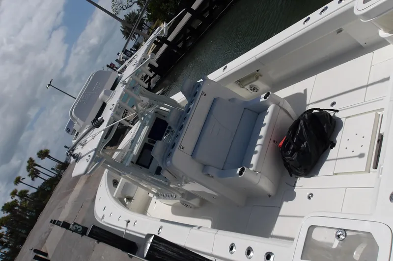  Yacht Photos Pics 2022 SeaVee 370z boat docked, showcasing spacious deck and seating area.