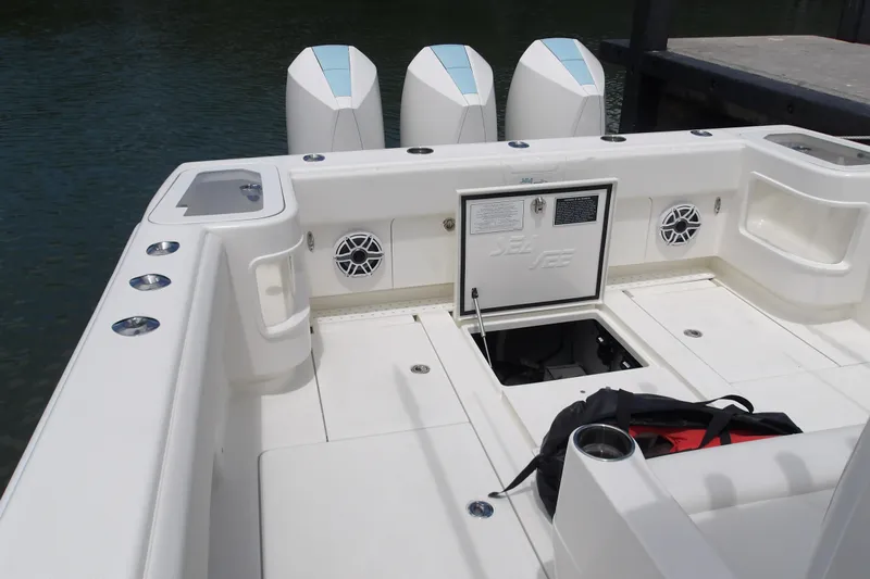  Yacht Photos Pics 2022 SeaVee 370z boat deck with triple outboard engines and storage compartments.
