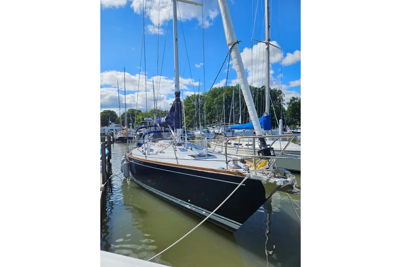 Cricket Yacht Photos Pics 1988 Tartan 40 sailboat docked in a marina under a clear blue sky.