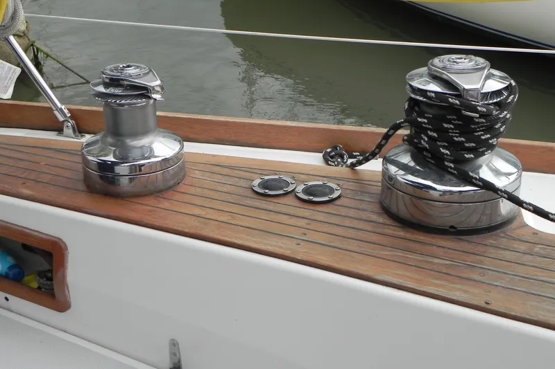 Cricket Yacht Photos Pics Deck of 1988 Tartan 40 sailboat with winches and rope, showcasing teak wood finish.