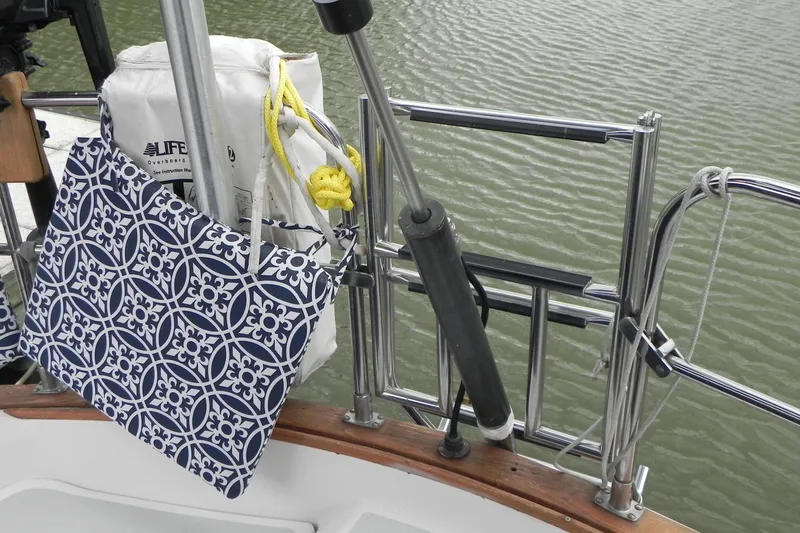 Cricket Yacht Photos Pics Sailboat deck with patterned cushion and life preserver, Tartan 40, 1988 model.