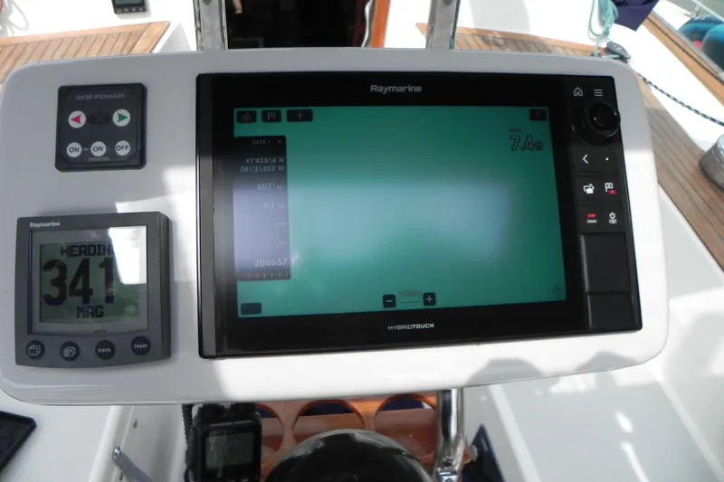 Cricket Yacht Photos Pics Cockpit navigation system on a 1988 Tartan 40 sailboat, featuring Raymarine displays.