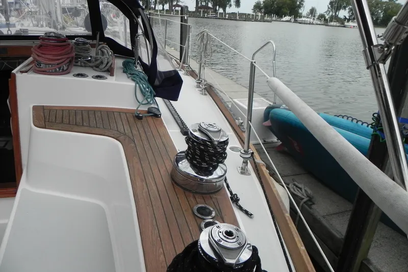 Cricket Yacht Photos Pics 1988 Tartan 40 sailboat deck with winches and ropes docked by the water.
