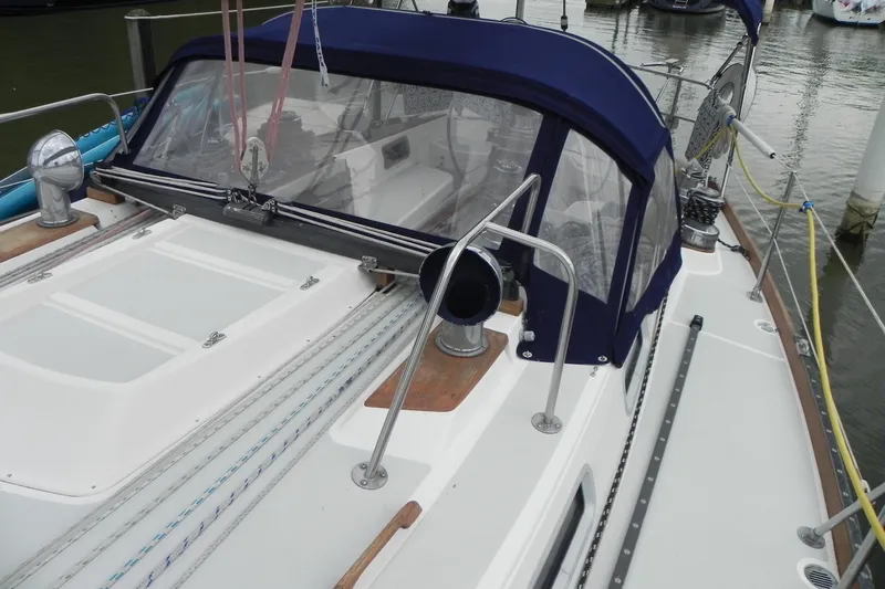 Cricket Yacht Photos Pics 1988 Tartan 40 sailboat deck with blue canopy and rigging details.