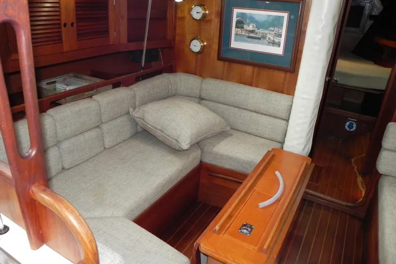 Cricket Yacht Photos Pics Interior of 1988 Tartan 40 sailboat with cozy seating and wooden accents.