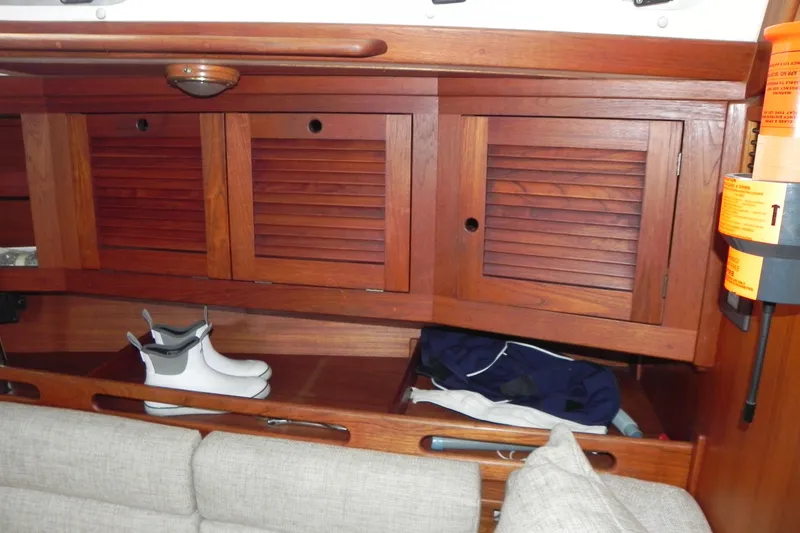 Cricket Yacht Photos Pics Interior of 1988 Tartan 40 sailboat with wooden cabinets and sailing gear.