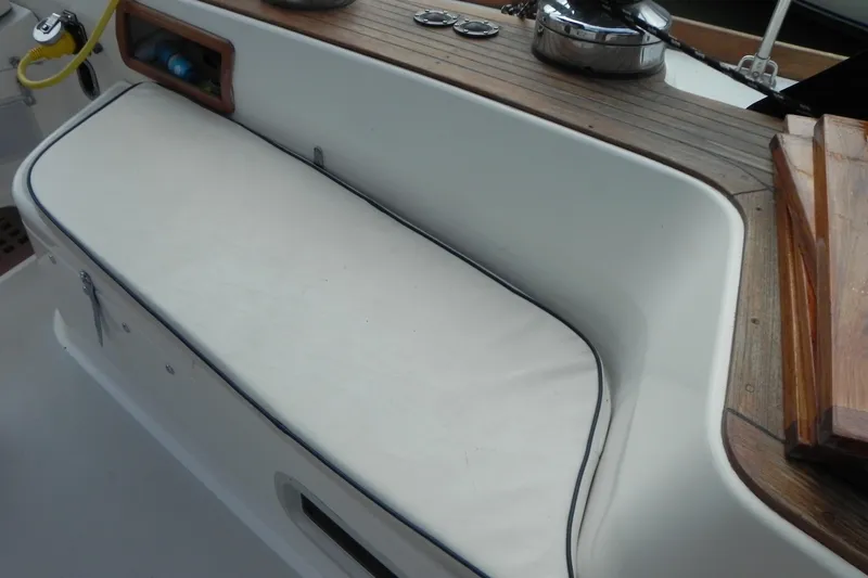 Cricket Yacht Photos Pics 1988 Tartan 40 sailboat cockpit with cushioned seating and wooden trim.