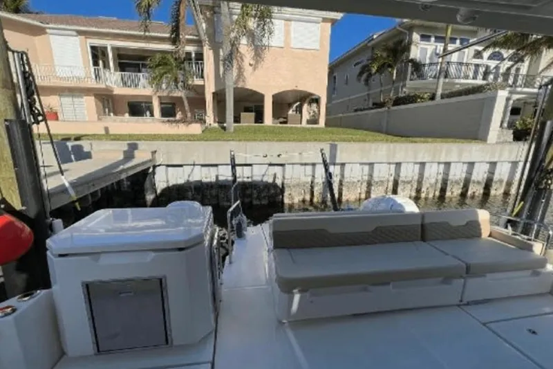  Yacht Photos Pics Aquila 36 Cruiser 2022 docked, featuring spacious seating and modern amenities.