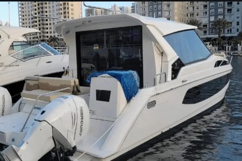  Yacht Photos Pics Aquila 36 Cruiser 2022 docked, featuring sleek design and powerful Mercury engines.