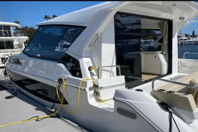  Yacht Photos Pics Aquila 36 Cruiser 2022 docked, showcasing sleek design and modern features.
