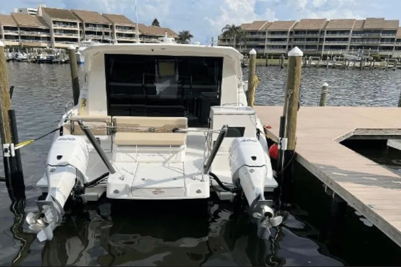  Yacht Photos Pics Aquila 36 Cruiser 2022 docked at marina with twin outboard engines.