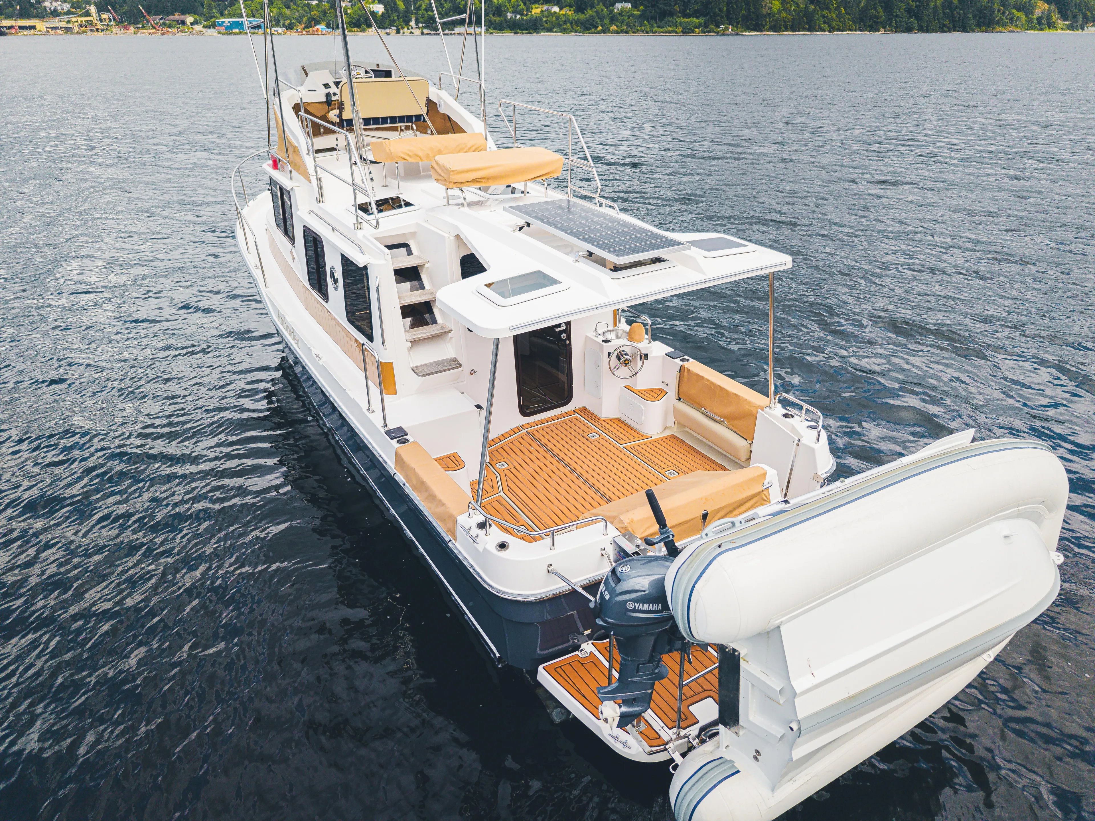 Ambraden Yacht Photos Pics 2022 Ranger Tugs R-31 CB boat on water, featuring spacious deck and modern design.