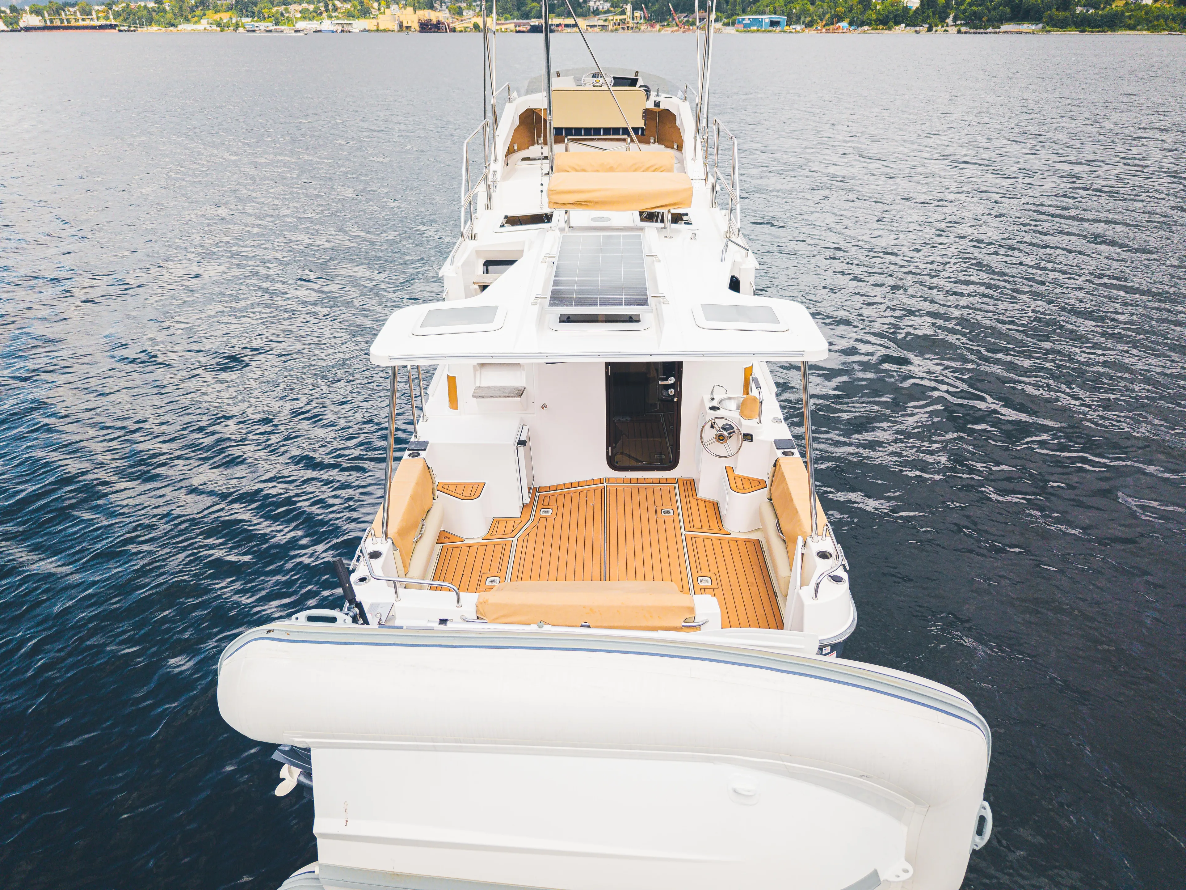Ambraden Yacht Photos Pics 2022 Ranger Tugs R-31 CB boat on water, featuring spacious deck and seating.