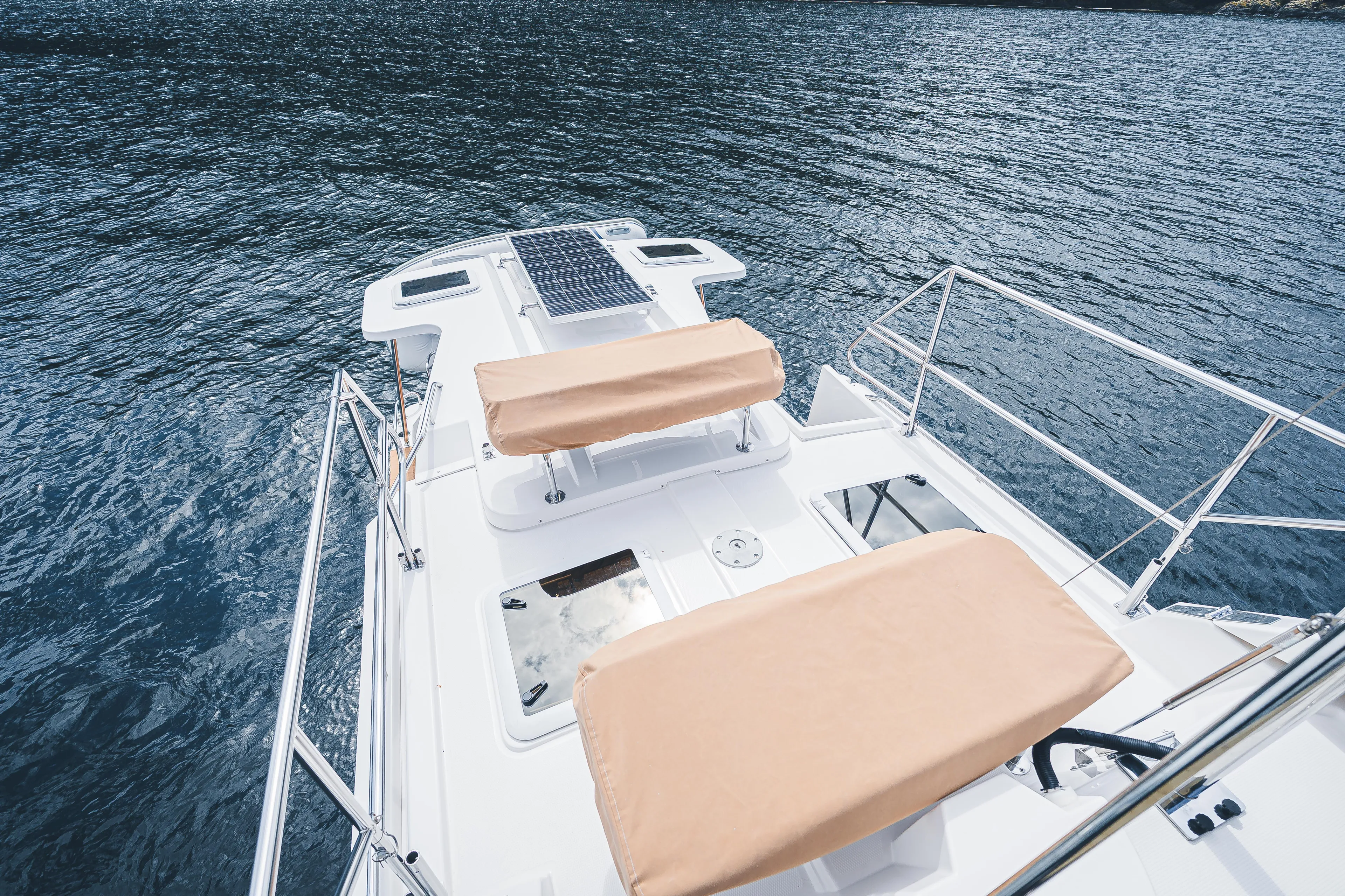 Ambraden Yacht Photos Pics 2022 Ranger Tugs R-31 CB boat deck with solar panel and cushioned seating.